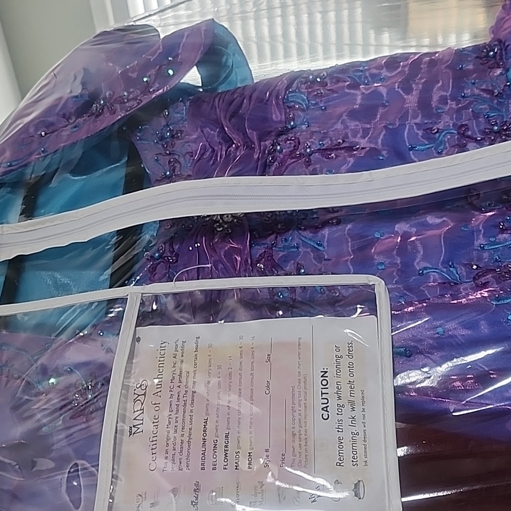 An original Mary's gown by P.C. Mary's, Inc.